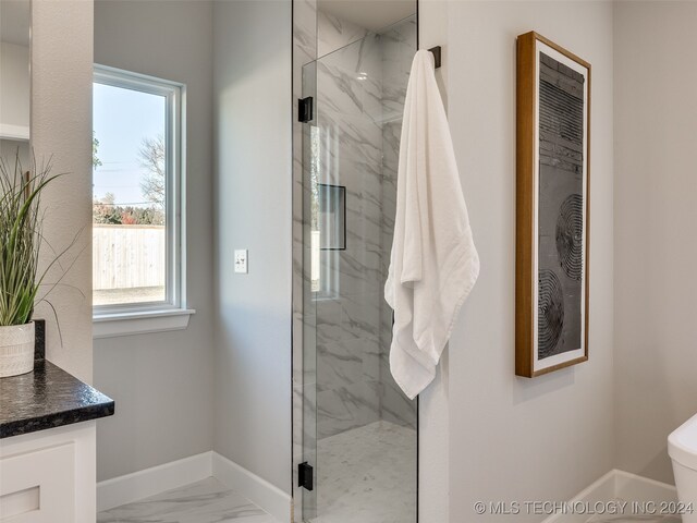 bathroom with vanity and an enclosed shower