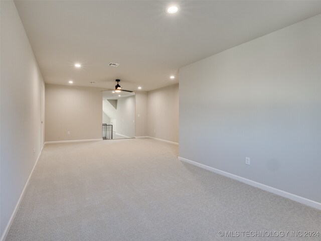 carpeted empty room with ceiling fan