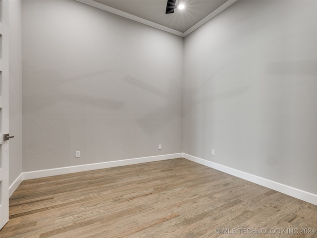 unfurnished room with ornamental molding and light hardwood / wood-style flooring