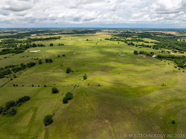 birds eye view of property with a rural view