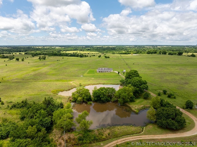 drone / aerial view featuring a water view and a rural view