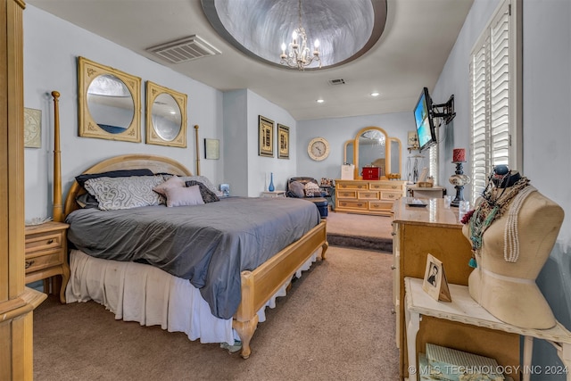 carpeted bedroom featuring an inviting chandelier