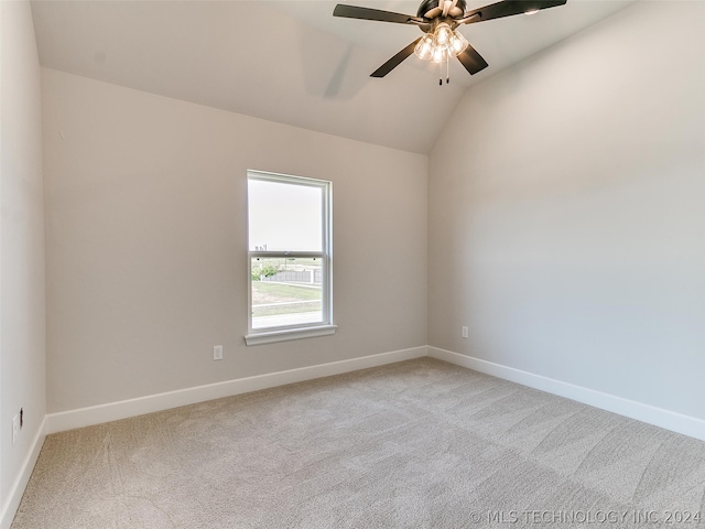 unfurnished room featuring carpet floors, ceiling fan, and vaulted ceiling