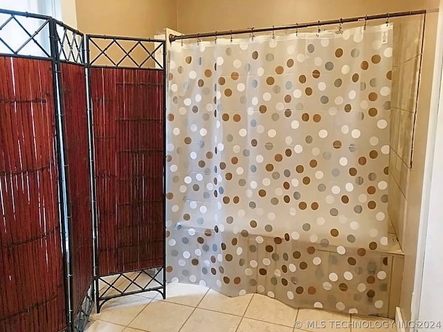 bathroom featuring tile patterned flooring and curtained shower