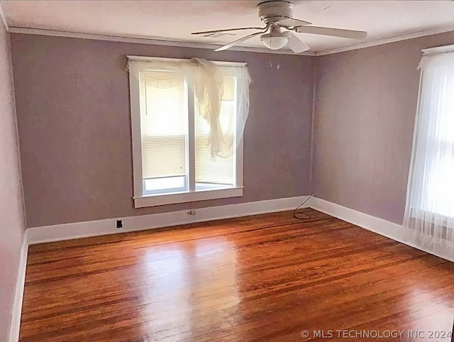 spare room with ceiling fan and wood-type flooring