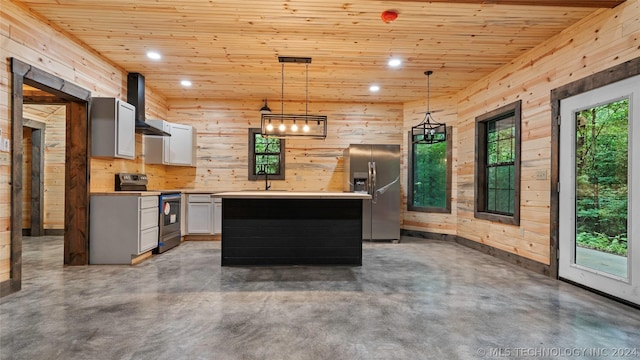 kitchen with pendant lighting, a center island, wall chimney exhaust hood, white cabinetry, and stainless steel appliances