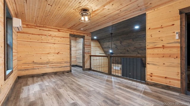 additional living space with wooden ceiling, hardwood / wood-style flooring, vaulted ceiling, and wooden walls