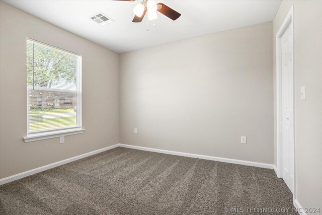 spare room with carpet flooring and ceiling fan