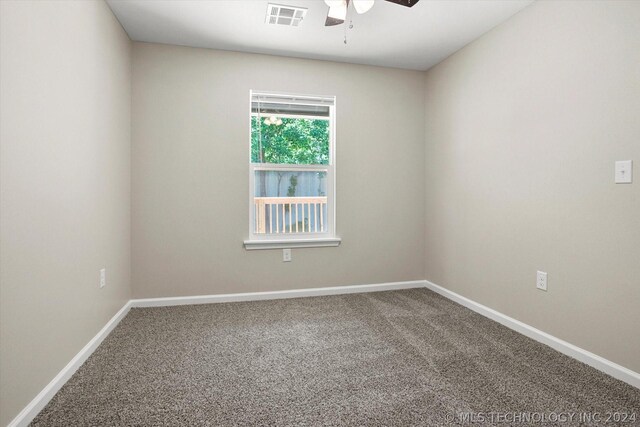 unfurnished room featuring carpet and ceiling fan