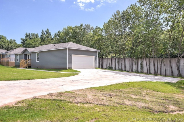 exterior space featuring a yard and a garage