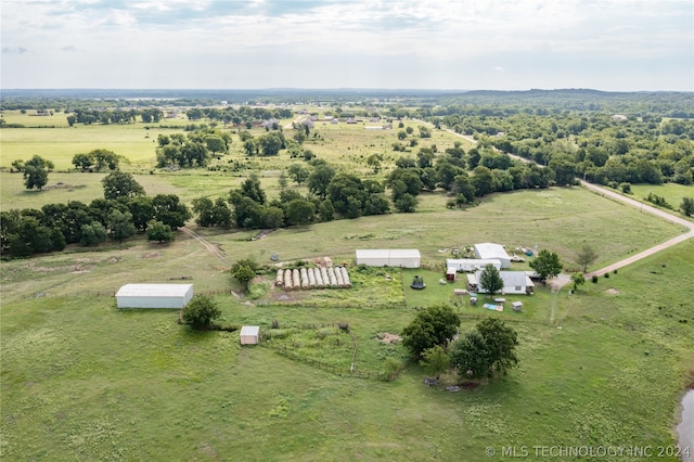 birds eye view of property with a rural view