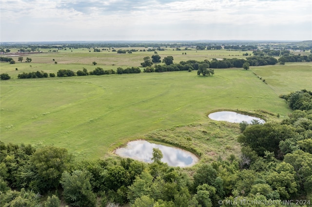 aerial view featuring a rural view and a water view