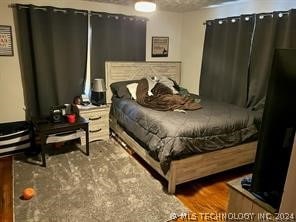 bedroom featuring hardwood / wood-style floors