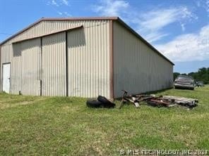 view of shed / structure featuring a yard