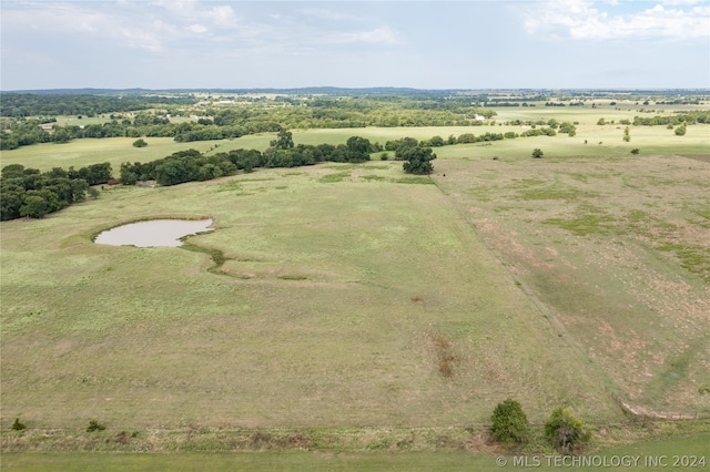 drone / aerial view with a water view and a rural view