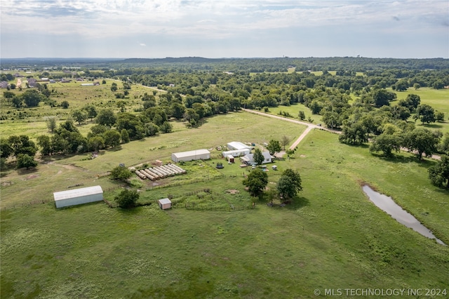 birds eye view of property with a rural view