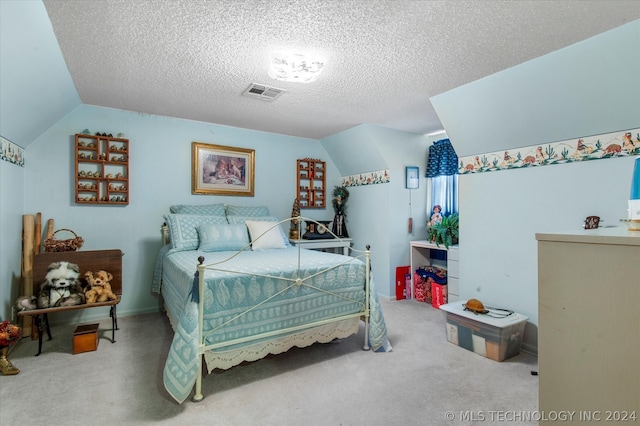 carpeted bedroom featuring a textured ceiling and lofted ceiling