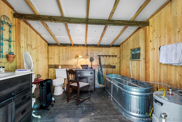 misc room featuring dark wood-type flooring, an AC wall unit, water heater, wooden walls, and radiator heating unit