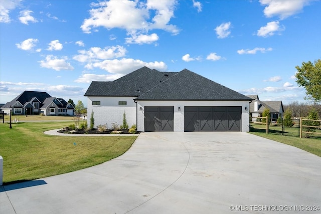 view of home's exterior featuring a lawn and a garage