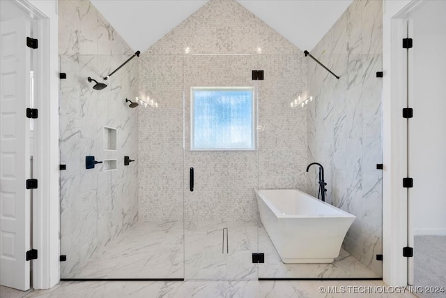 bathroom with lofted ceiling, sink, independent shower and bath, and tile walls