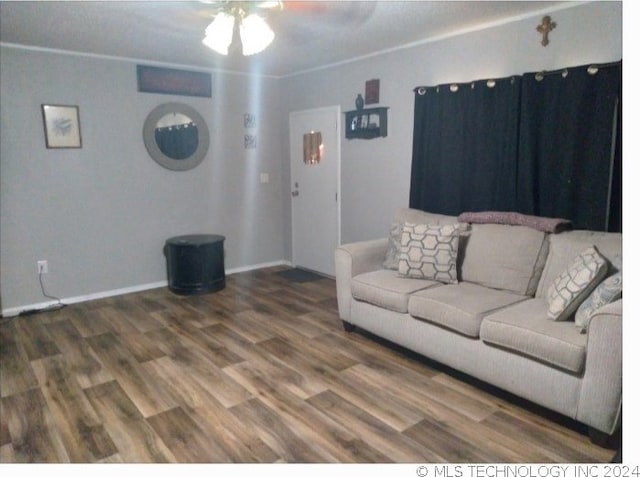 unfurnished living room with ceiling fan and wood-type flooring