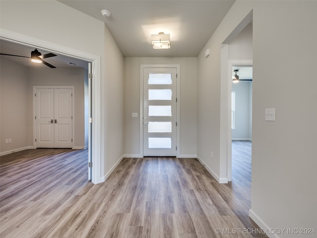 entryway with ceiling fan and light wood-type flooring