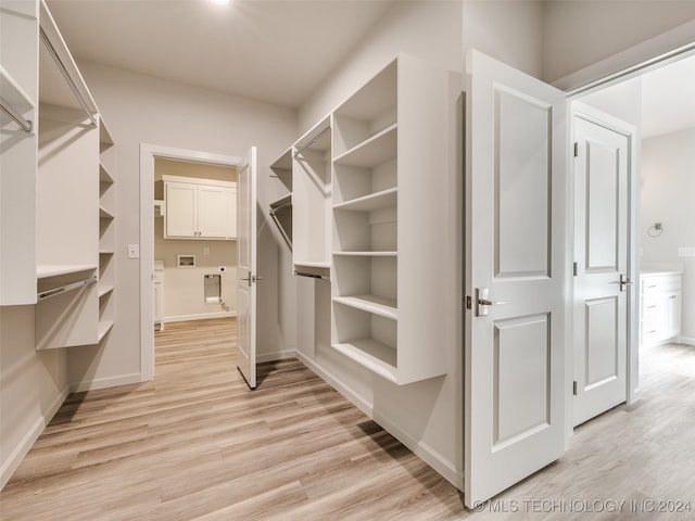 walk in closet featuring light wood-type flooring