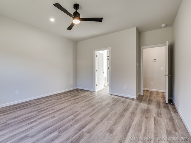 unfurnished bedroom with light hardwood / wood-style flooring and ceiling fan