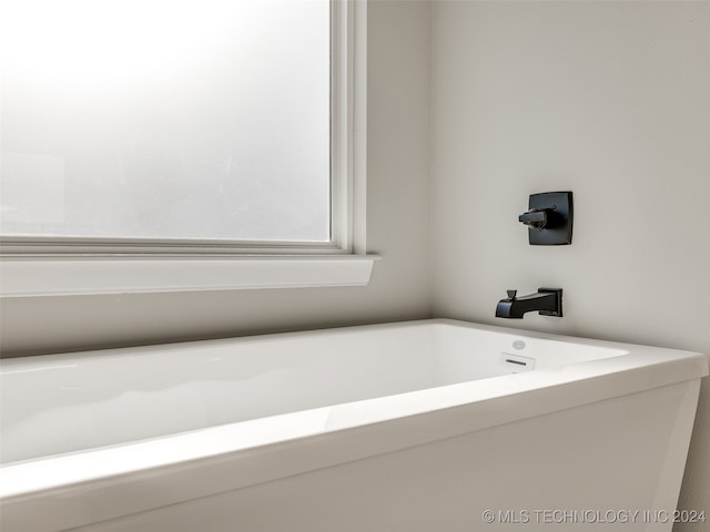 bathroom featuring a tub to relax in