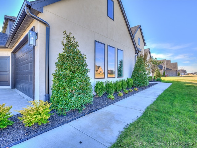 view of home's exterior featuring a yard