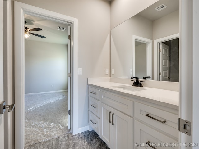 bathroom featuring ceiling fan and vanity