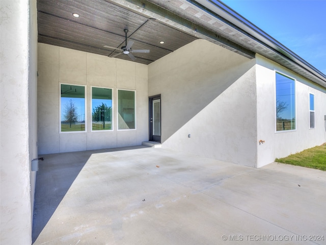 view of patio featuring ceiling fan