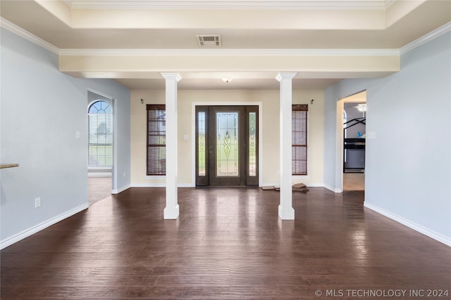 foyer with dark hardwood / wood-style floors, a healthy amount of sunlight, and decorative columns