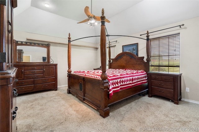 carpeted bedroom with vaulted ceiling and ceiling fan