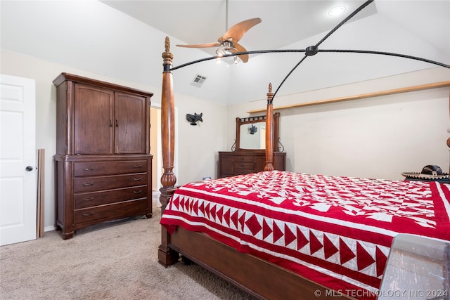 bedroom with ceiling fan, vaulted ceiling, and light carpet