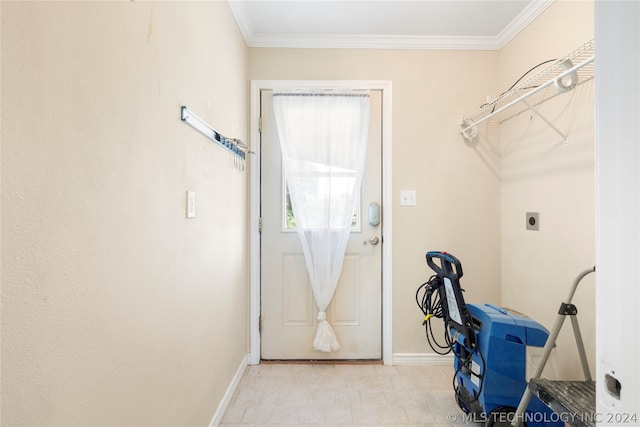 clothes washing area with light tile flooring, crown molding, and hookup for an electric dryer