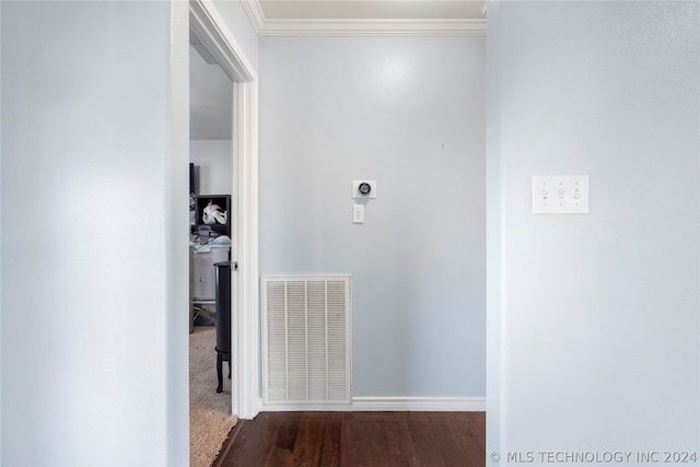 corridor featuring crown molding and dark wood-type flooring