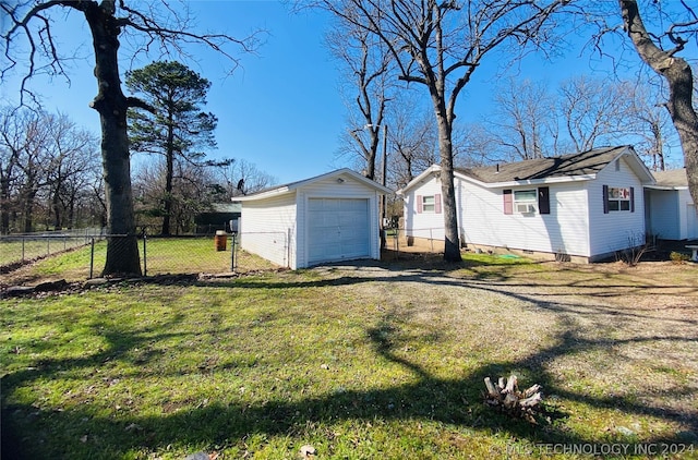 view of home's exterior featuring an outbuilding, a garage, and a lawn