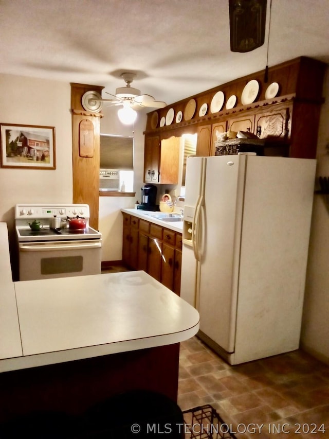 kitchen featuring ceiling fan, white appliances, and sink