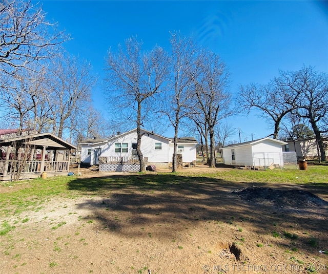 view of yard with a wooden deck