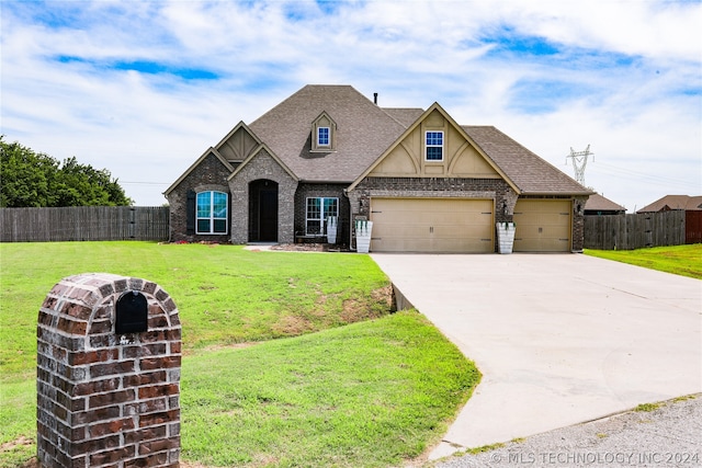 view of front facade with a garage and a front yard