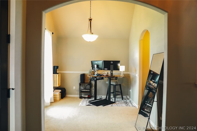 office featuring lofted ceiling and carpet flooring