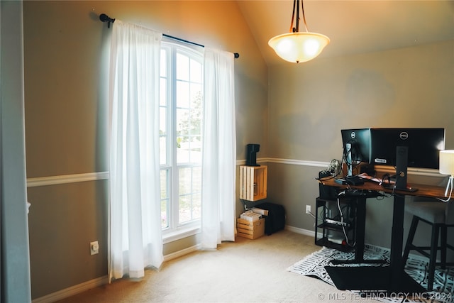 carpeted office featuring vaulted ceiling