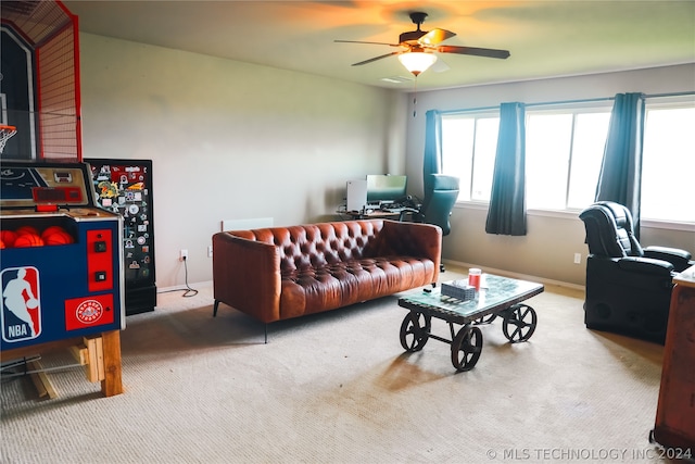 carpeted living room featuring ceiling fan