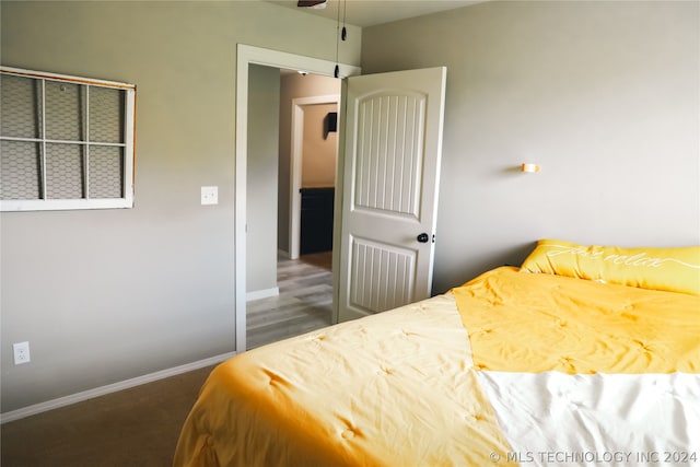 bedroom with dark carpet