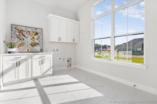 washroom featuring washer hookup, cabinets, gas dryer hookup, and electric dryer hookup