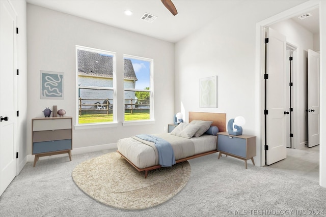 bedroom featuring ceiling fan and light carpet