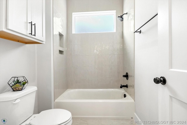 bathroom with toilet and  shower combination