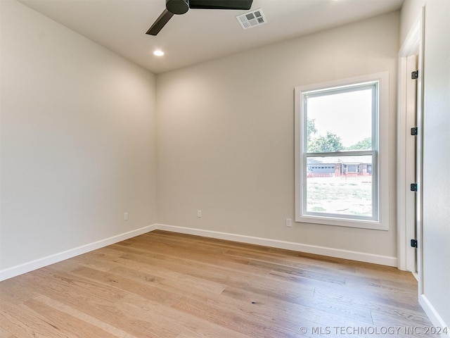 unfurnished room featuring ceiling fan and light hardwood / wood-style flooring