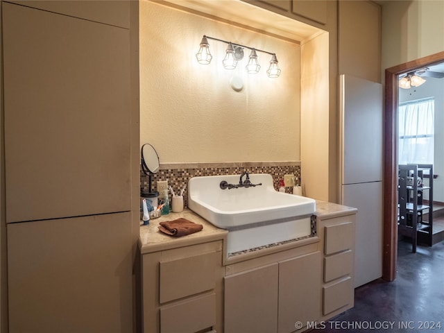 bathroom with ceiling fan, vanity, and concrete floors